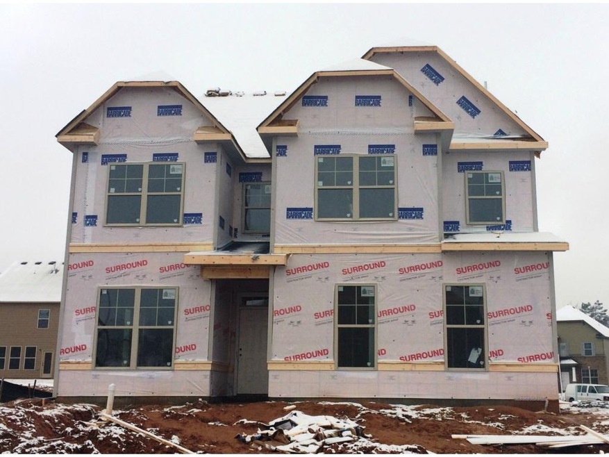 The Madison with side entry garage on corner lot. 