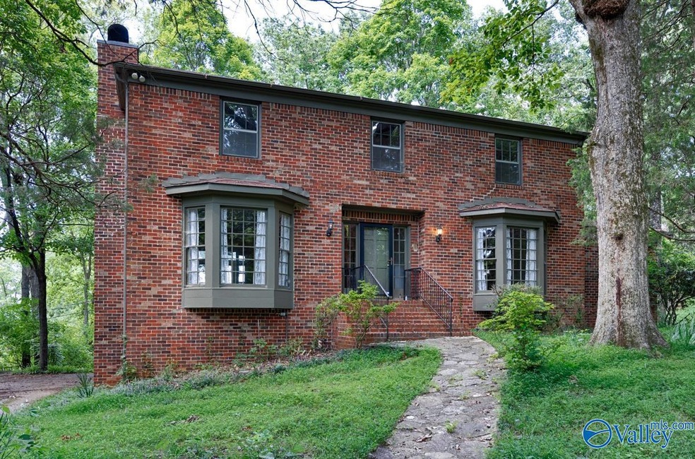 Huge private lot in upper Blossomwood!  Renovate this character home today and have a private retreat just minutes from downtown Huntsville!