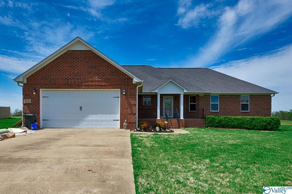 Full brick home featuring two car attached garage,