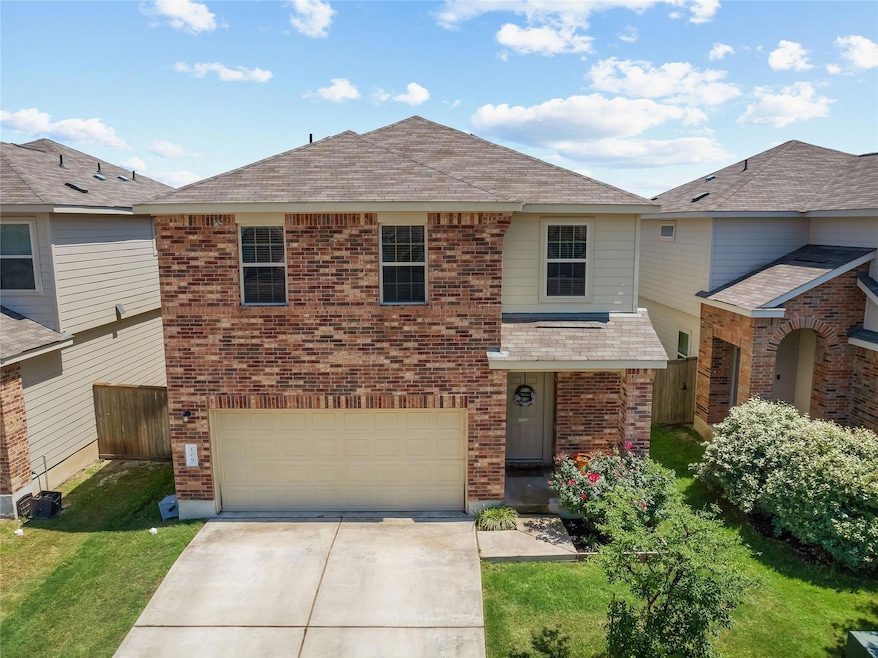 View of front of property featuring driveway, an 