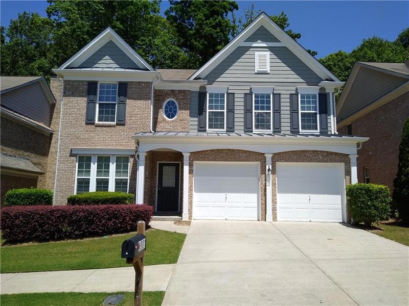 Stately front with brick on three sides.