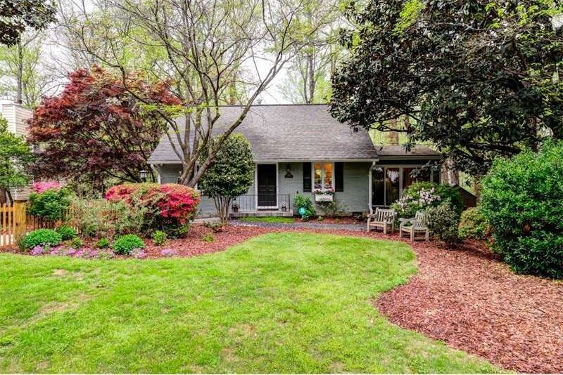 Azaleas galore and lush landscaping in flat fenced