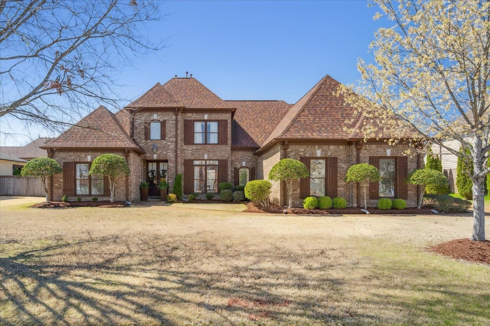 Tudor home with a front lawn
