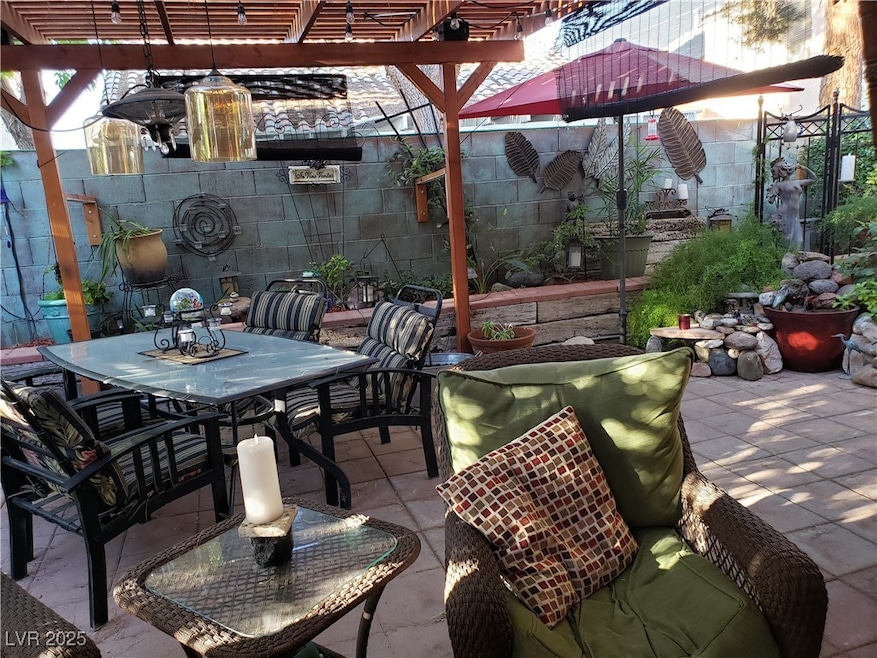 View of patio garden featuring outdoor dining spac