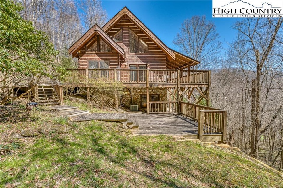 Beautiful log cabin on nearly 13 acres in Vilas, N
