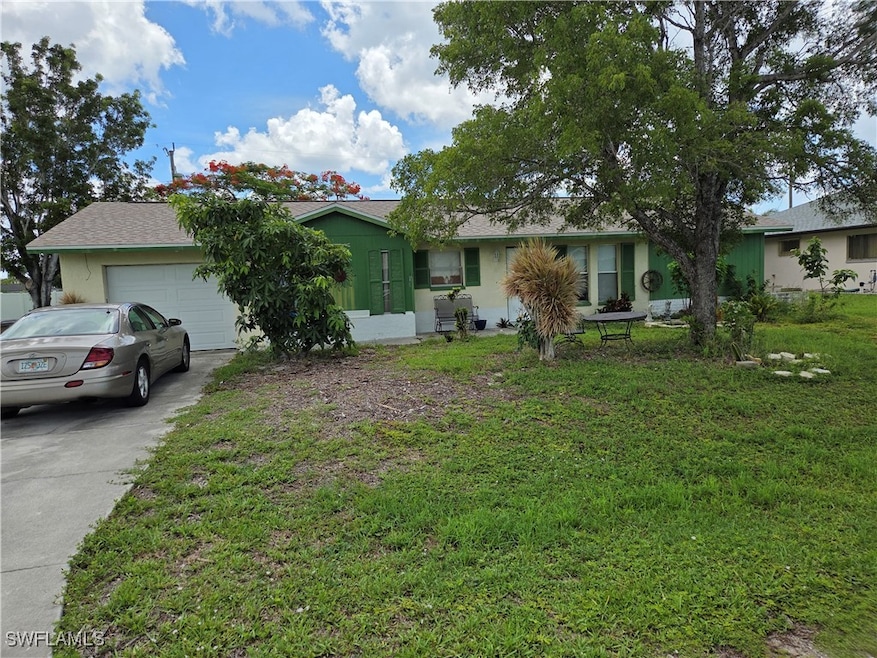 Single story home with an attached garage, concret