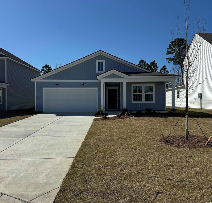 View of front of property with a front lawn, concr