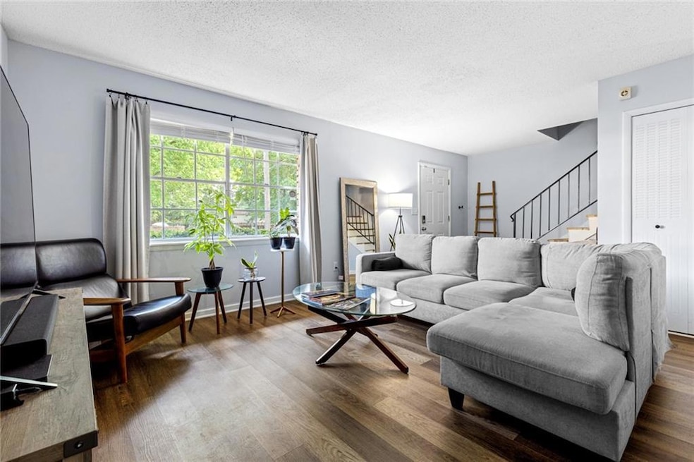 Living room featuring dark hardwood / wood-style f