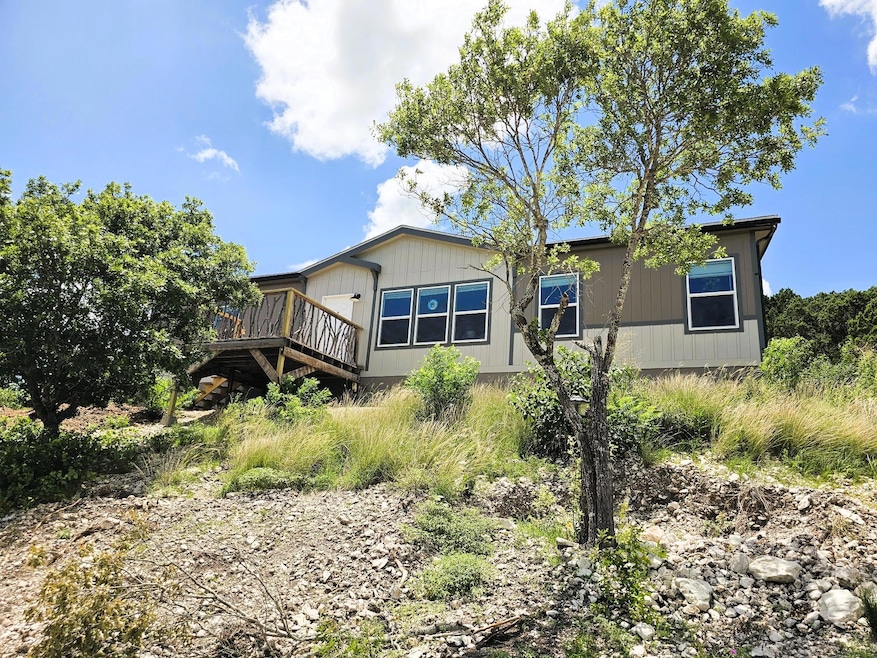 Rear view of house with a deck