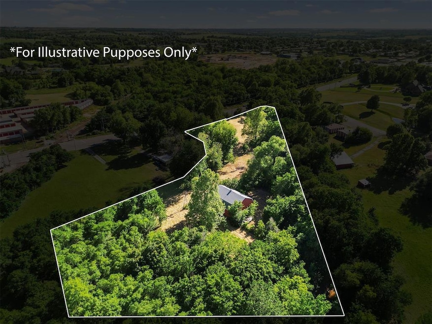 Aerial view of property's location featuring property parcel outlined and a forest