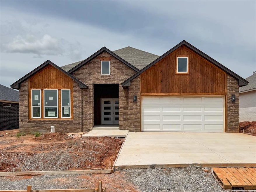 View of front facade featuring roof with shingles,