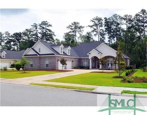 Exterior Front. Pretty curb appeal on this brick h