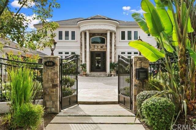 Grand palatial gated estate with two story pillare
