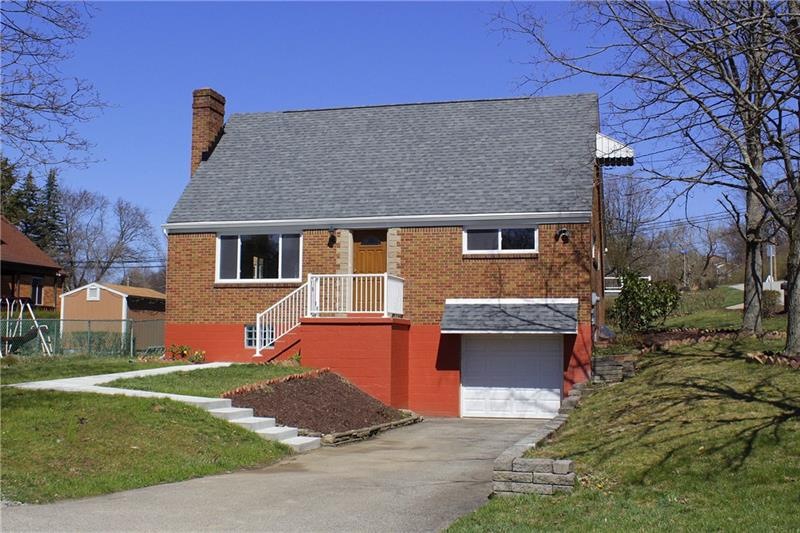 Attractive exterior is accented with new roof, new