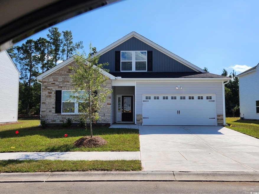 View of front of property with a garage and a fron