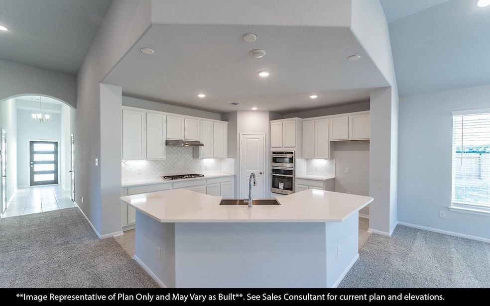 A bright and open kitchen that effortlessly blends style and function, highlighted by beautiful luxury wood-like vinyl floors throughout for a warm, low-maintenance touch. The spacious layout offers room for cooking, entertaining, and making memories with family and friends. **Image Representative of Plan Only and May Vary as Built**.