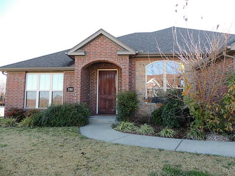 Exterior Front. Clean lines and brick façade give