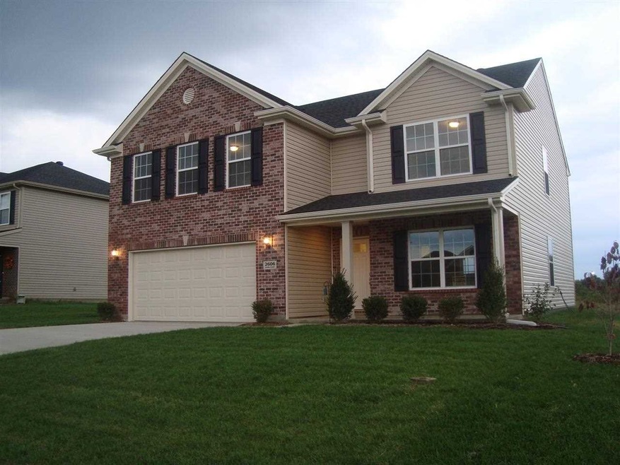 Lush sodded lawn, and landscaping. A covered front