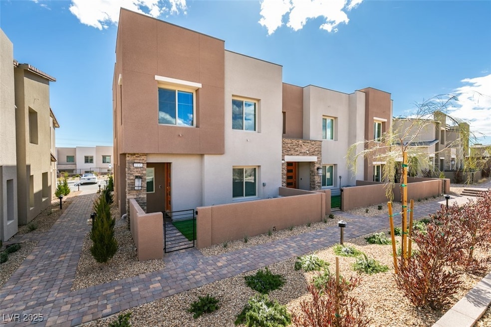 Rear view of house featuring a fenced front yard,