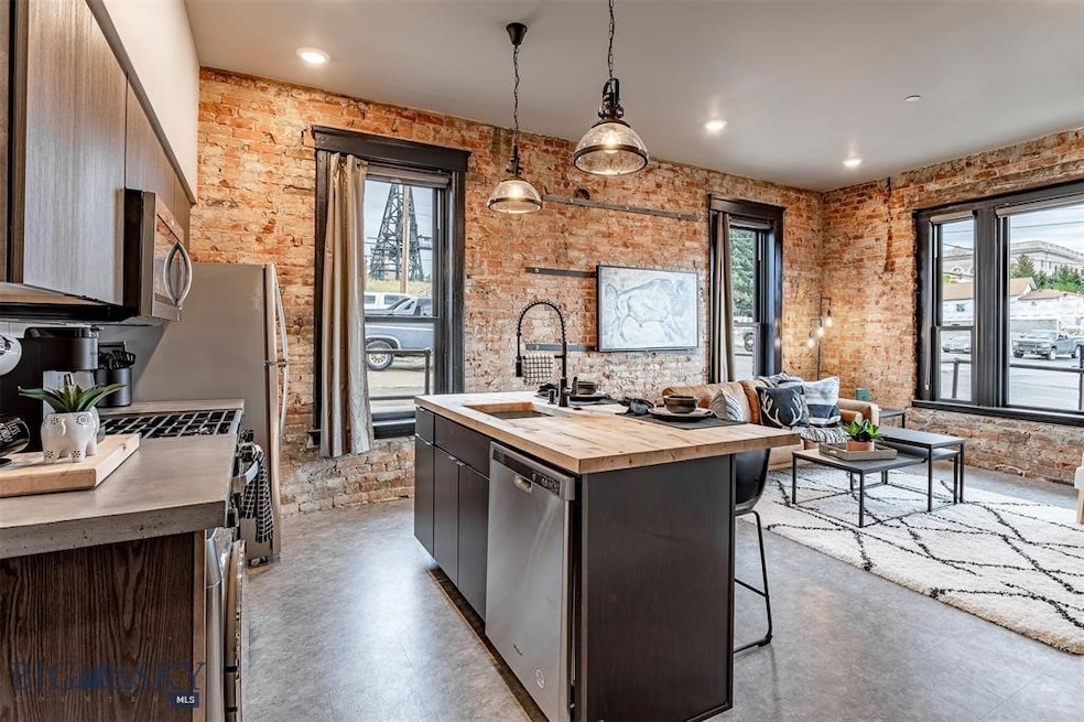 Kitchen with sink, an island with sink, a kitchen