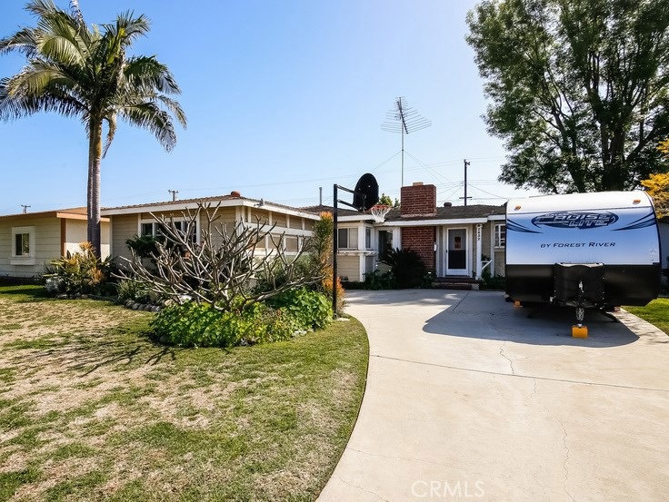 Front of home with garage view on left hand side. RV no longer at property.