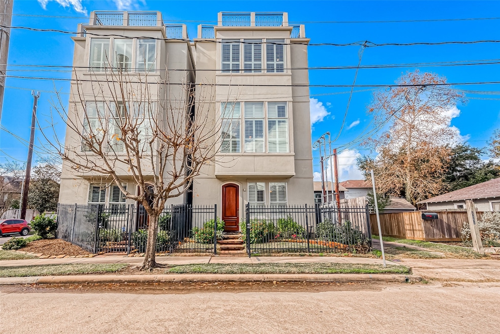 This modern three-story home features large window