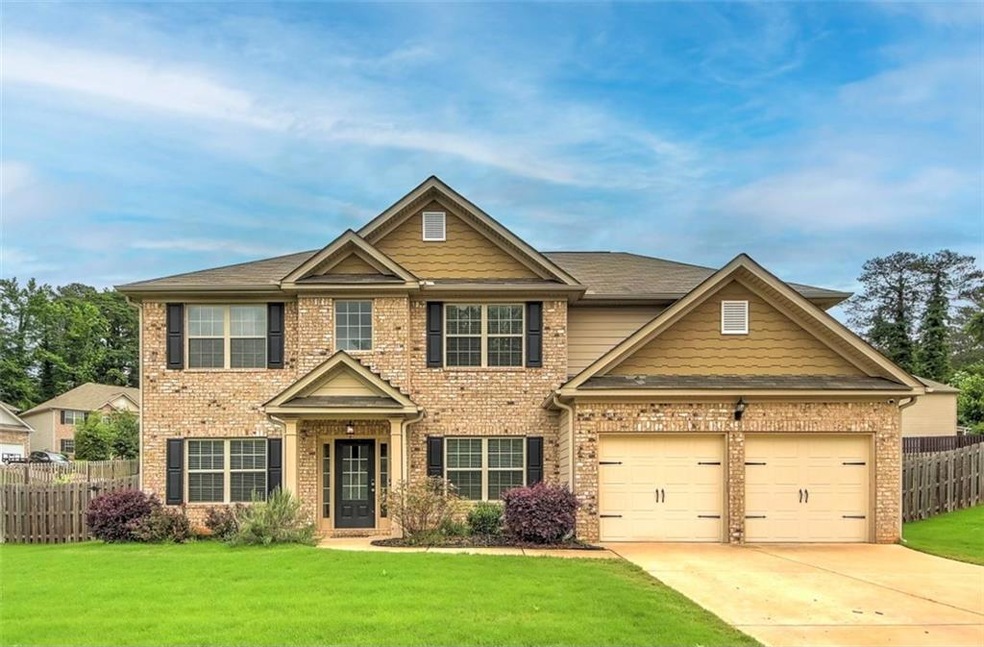 Craftsman-style home featuring a garage and a fron