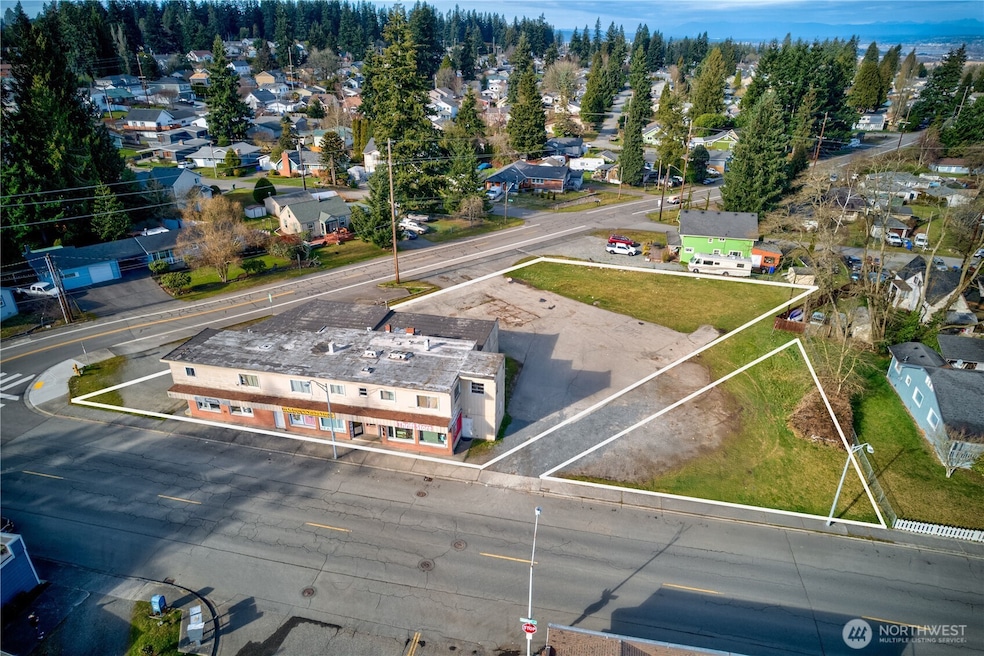 Dynamic mixed-use asset in Everett’s revitalizing urban core. Interurban Crossing spans a 26,572 SF corner lot with alley access, 20+ parking spaces, and a 7,629 SF structure leased to stable local tenants—3 storefronts, 3 apartments, and 3 flex spaces. Current gross rent over $64K; pro forma $144K+ with light upgrades. Just 26.3% lot coverage—NB zoning + Opportunity Zone offer phased development potential. Steps from the Interurban Trail, future light rail, and new stadium district. A walkable, well-connected location with built-in income and big upside....
