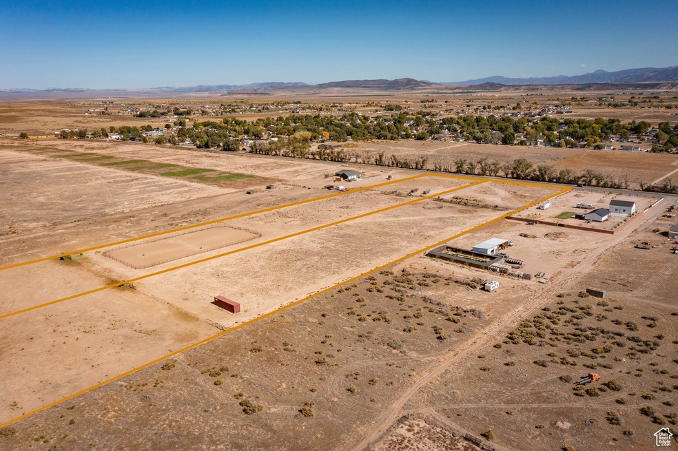 Birds eye view of property with a mountain view