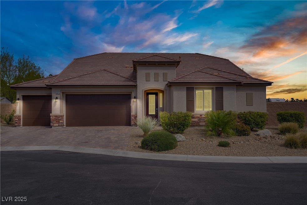 View of front of property with stucco siding, ston