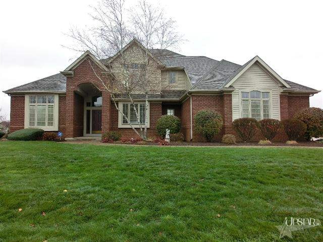 Wonderful pond lot; Attractive brick front on this