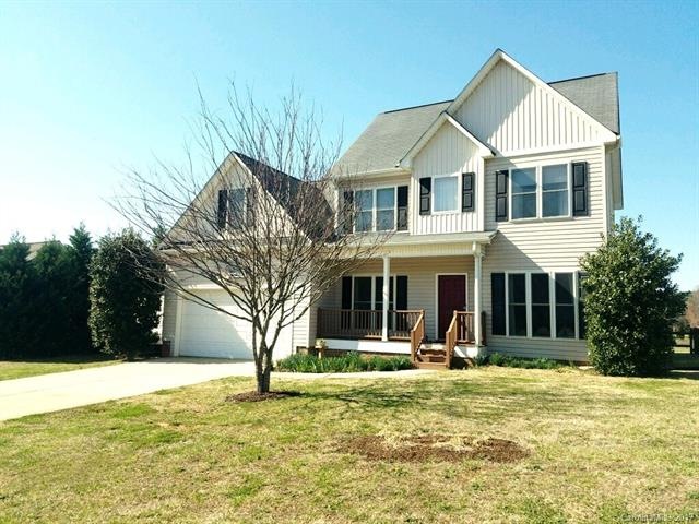 Front View with Extra Parking Pad to Left of Garage for RV