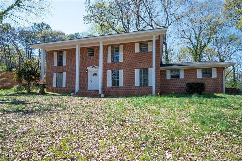 Greek revival inspired property with brick siding,