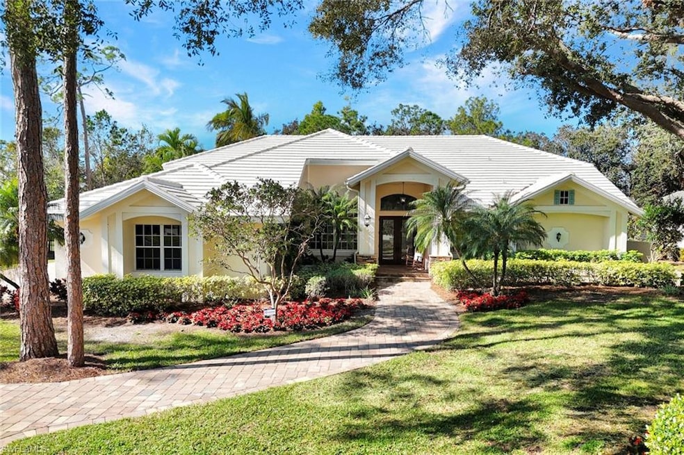 Ranch-style home with a front lawn and french door