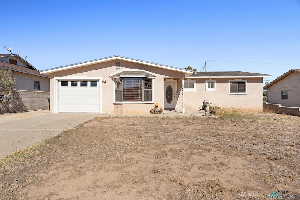 Ranch-style home featuring stucco siding, concrete driveway, and a garage