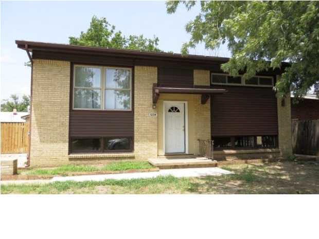 Front of charming home with mature trees