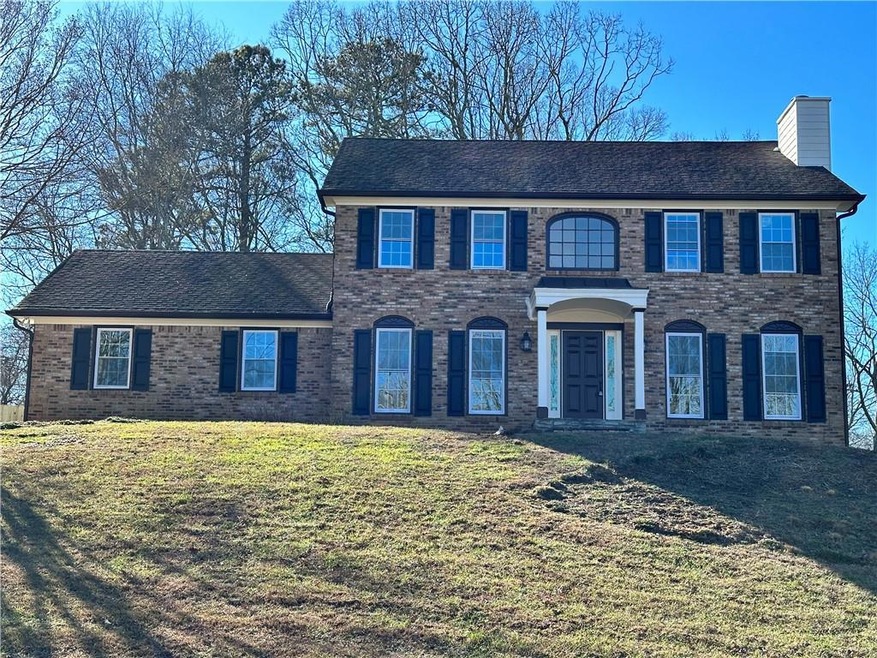 Colonial inspired home with a front lawn