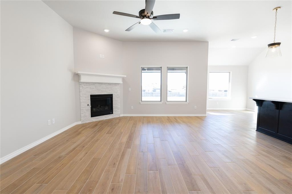 Unfurnished living room with ceiling fan, light wo