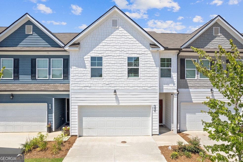This home stands out with beautiful curb appeal.  The crisp white shake makes this home truly pop!