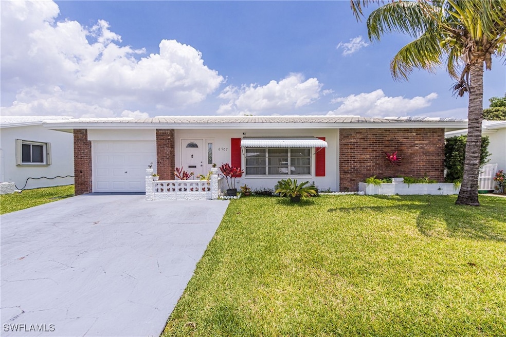 Ranch-style home featuring driveway, an attached g
