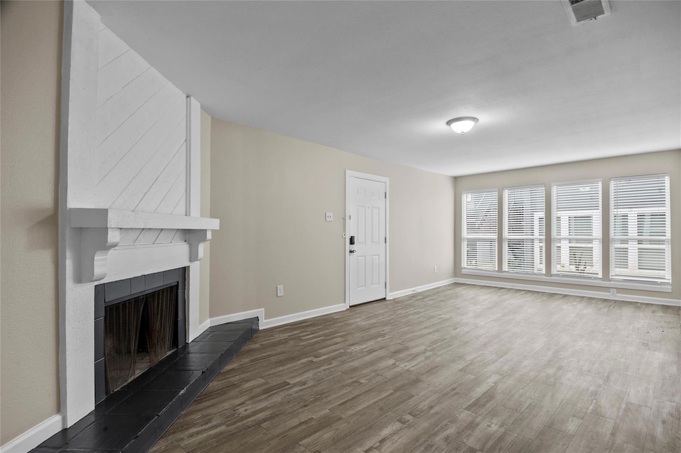 Unfurnished living room featuring vinyl plank floo