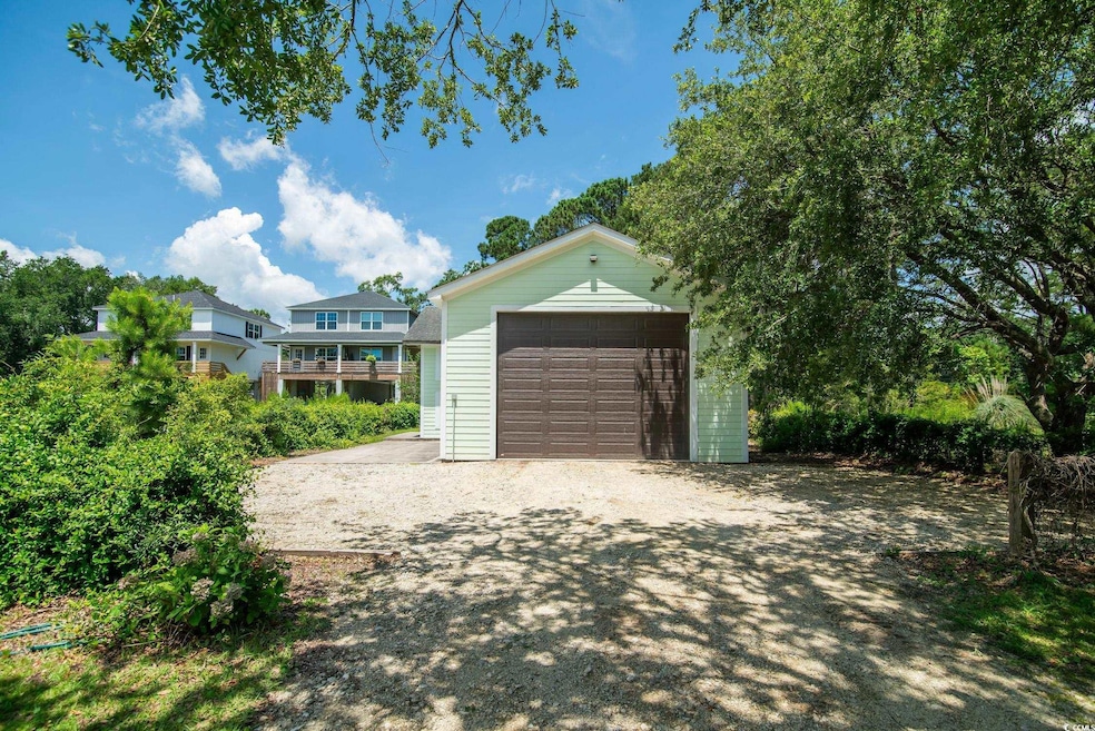 Detached garage featuring driveway