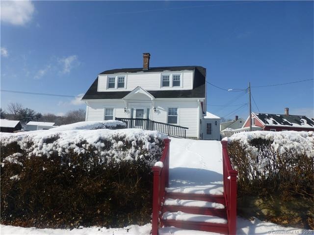 Front of home from road.  Driveway is to the left 