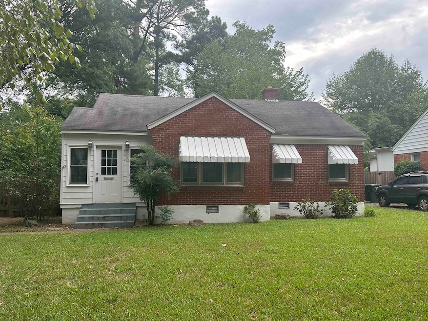 Exterior space with a yard