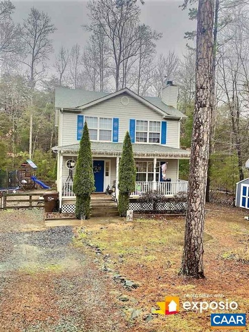 gorgeous rear yard with deck overlooking streams a