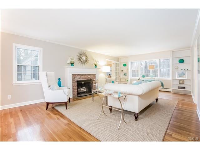 Front to back living room with hardwood floors and