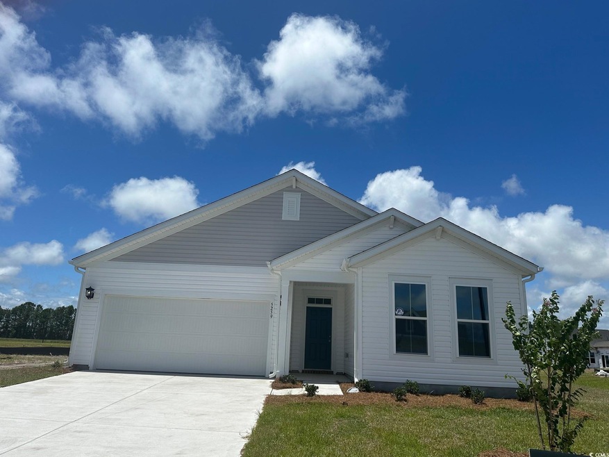 View of front of property with a garage and a fron