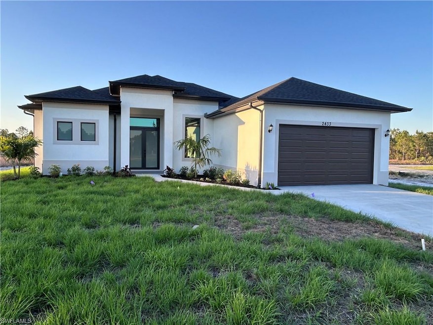 View of front of property with stucco siding, an a