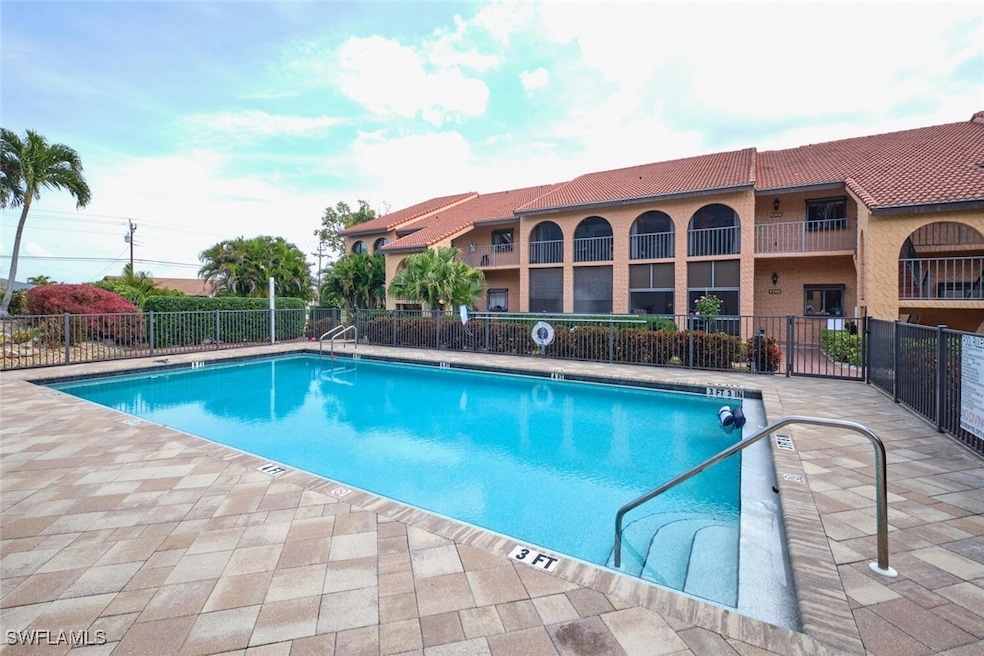 Community pool with a patio