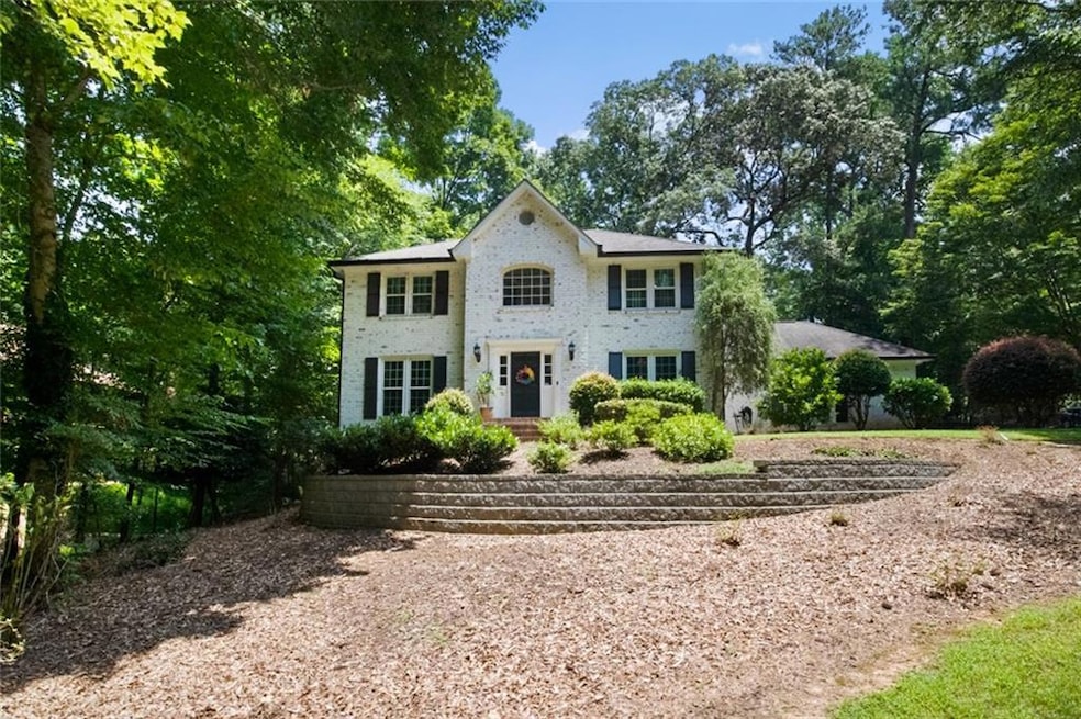 View of front of house featuring brick siding